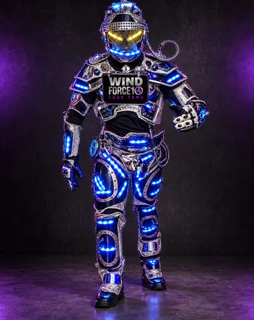 LED robot performer in silver with blue LEDs and yellow eyes